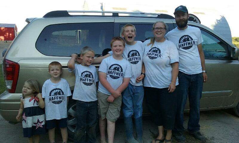 Haffner family posing by the van