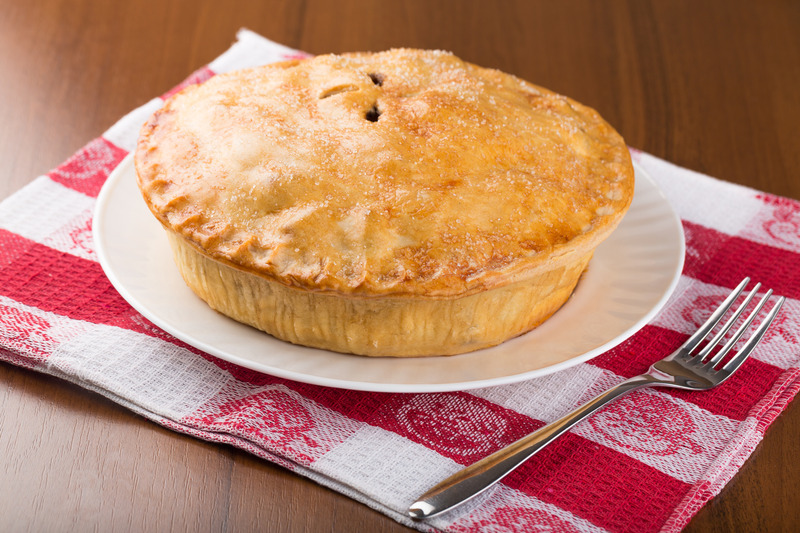 rhubarb pie on a checkered napkin