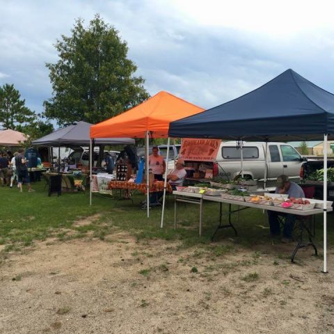 vendors at the market, 4 tents with a few customers