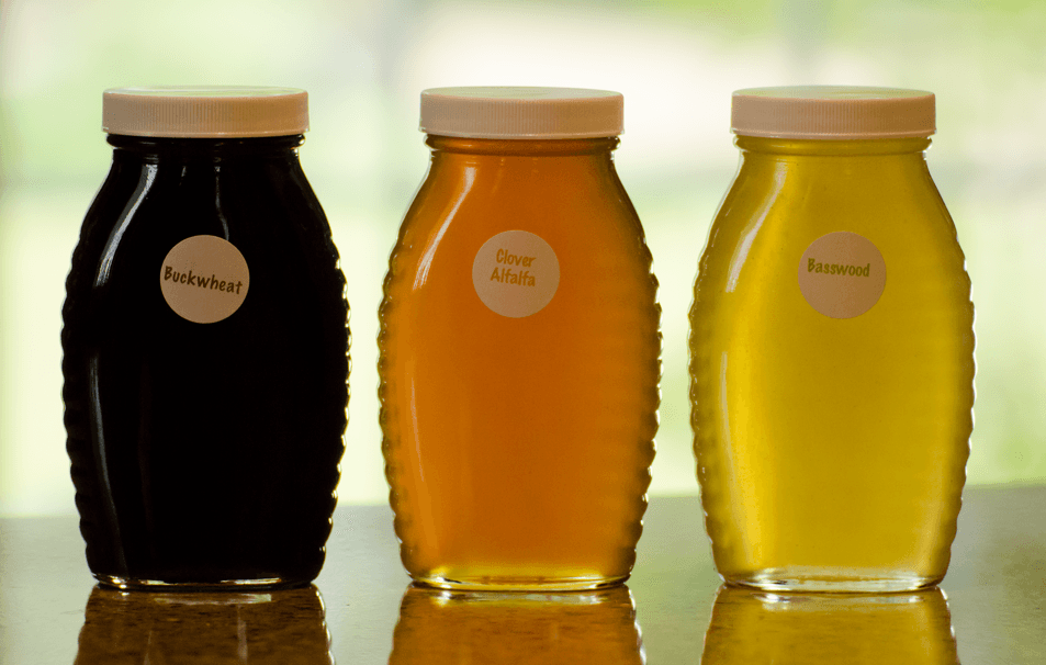 Glass container of three differnet types of honey