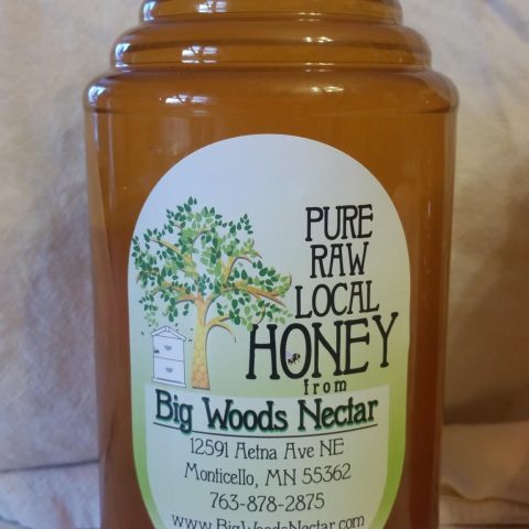 Pure, raw honey bottle