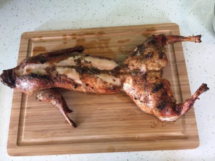 Roasted whole rabbit on a cutting board