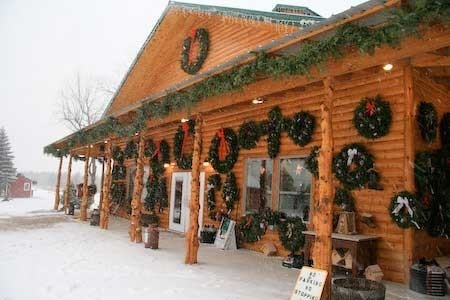 Outside of the gift shop covered in wreaths and garland for sale