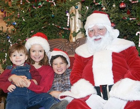 Kids posing for a photo with Santa