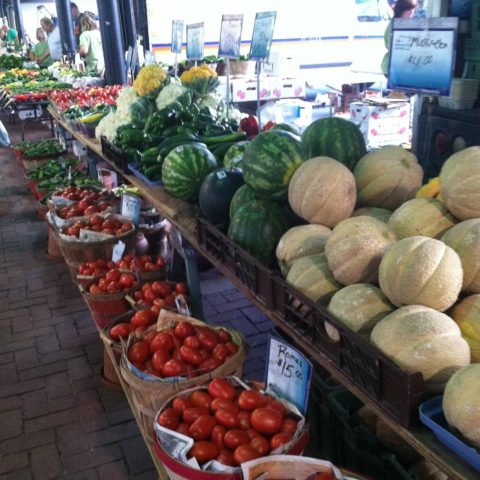 Melons, tomatoes, cauliflower in baskets