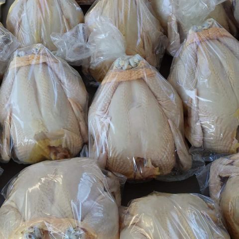 whole chickens in plastic wrap