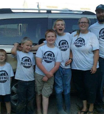 Haffner family posing by the van