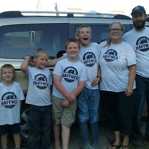 Haffner family posing by the van