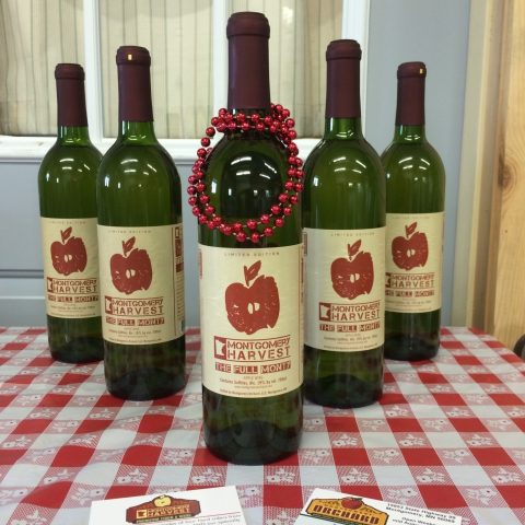 Montgomery Harvest bottles with business cards on a checkered table