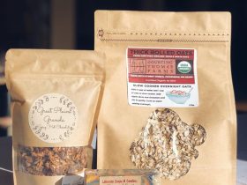 Two bags of granola and another product displayed on a table