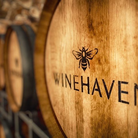 Professional photo of a slated multi-dimensional photowine barrels with the logo