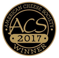 American Cheese Society Winner award logo. It is a black circle with gold words.