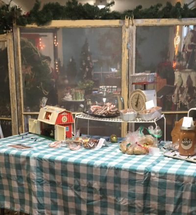 Roper Farms vendor table at a farmer's market