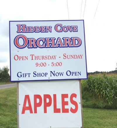 Hidden Cove Orchard sign along main road
