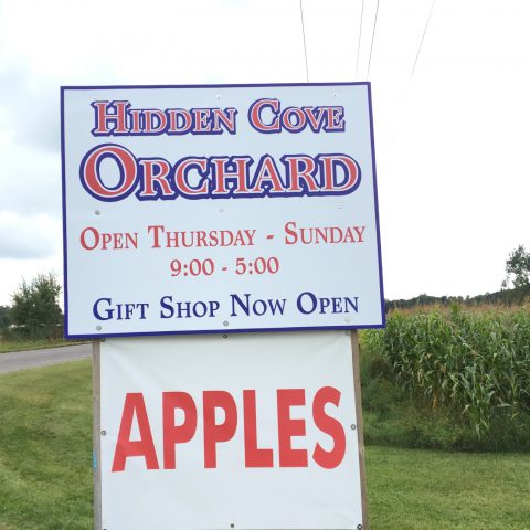 Hidden Cove Orchard sign along main road