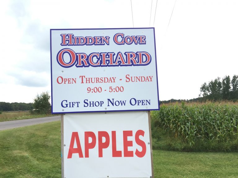 Hidden Cove Orchard sign along main road