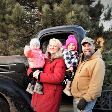 family photo in front of an old pickup