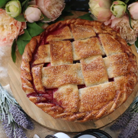 fresh baked pie surrounded by flowers
