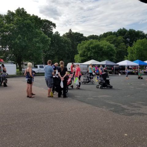 people standing in the center of the farmers market plaza