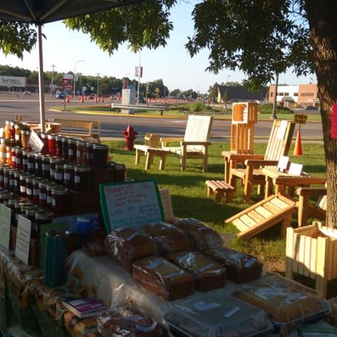 baked good market display under shaded area