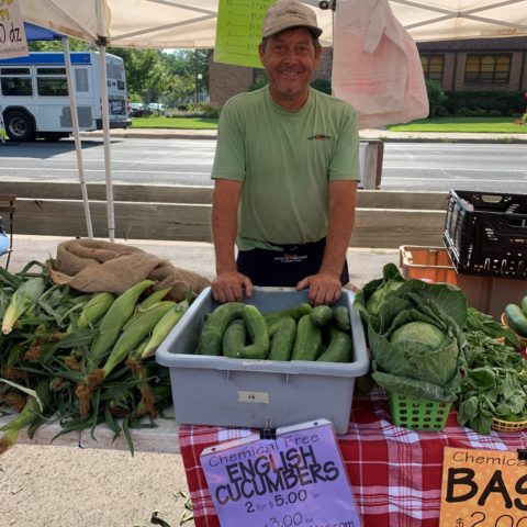 Co-owner, Peter, at his farmers market booth