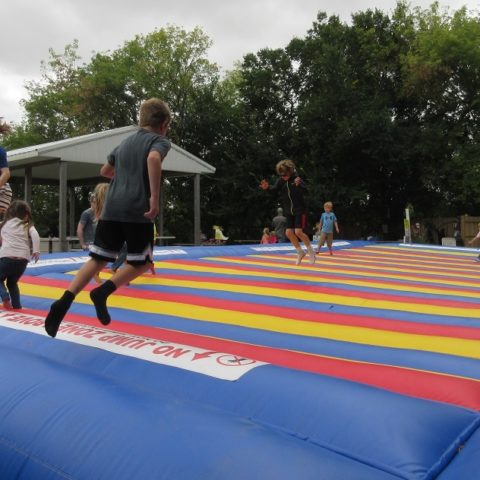 kids jumping on a bounce pad