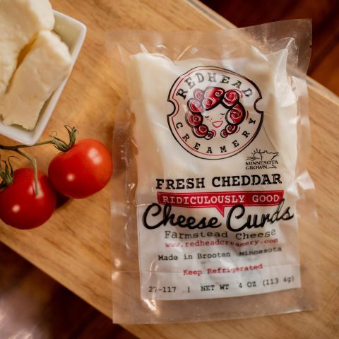 Close up of a package of Redhead Creamery cheddar cheese curds.