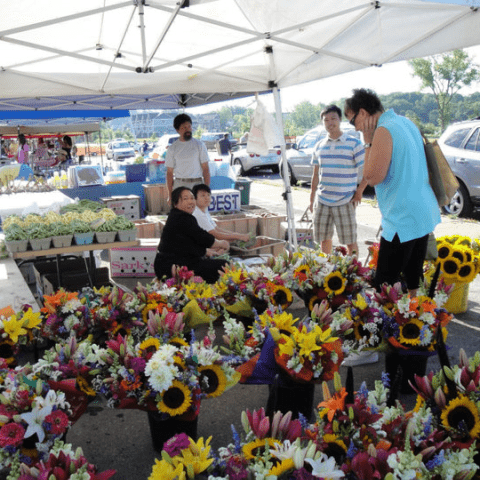 picture of floral bouquets in farmers market stand