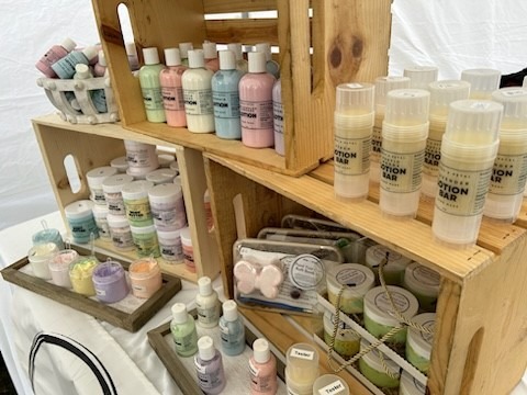 Shelves of candles, lotions, and soaps.