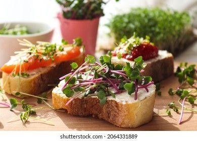 Show of slices of bread with microgreens on top.