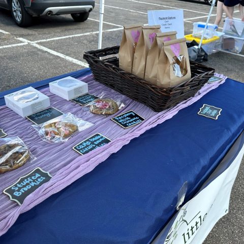 farmers market stand with baked goods