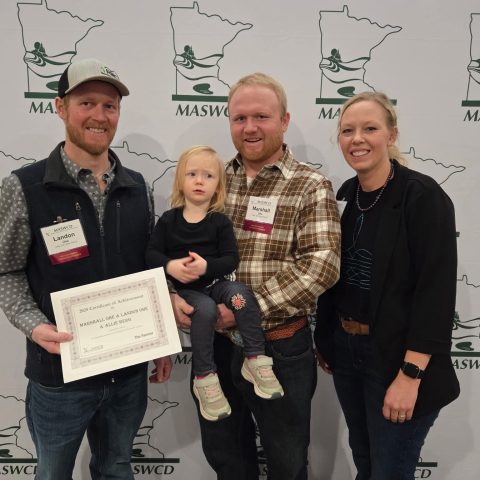The Ohe family receiving award for sustainability.