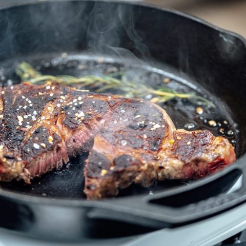 Beef cooking in pan