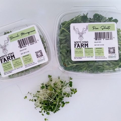 A picture of two packaged microgreens from White Stag Farm.