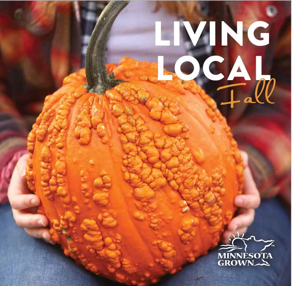 Magazine cover Living Local Fall by Minnesota Grown featuring a large warty pumpkin sitting in the lap of a person wearing flannel