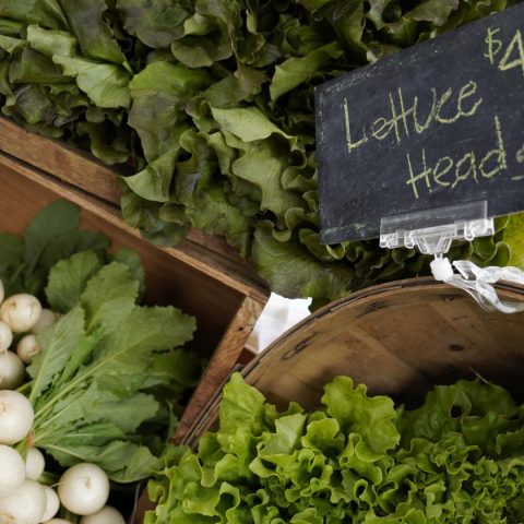 radishes and lettuce in wooden crates