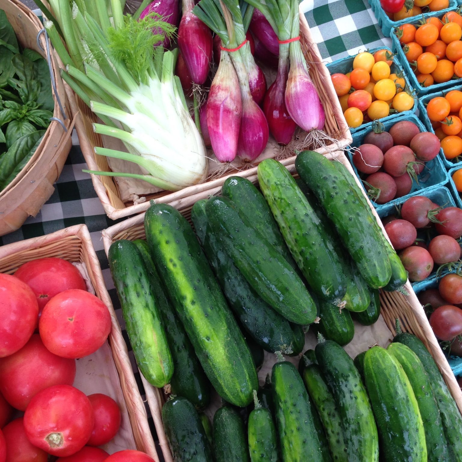 spread of vegetables for sale at a farmers market