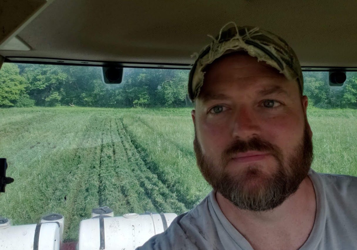 A farmer in a tractor.