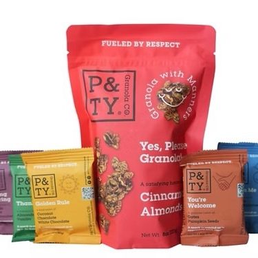 one large red granola bag surrounded by five granola bars in colored packages: from left to right, purple, green, yellow, brown blue