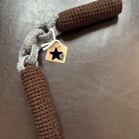 crochet nunchuks with a brown handles and gray crochet chain
