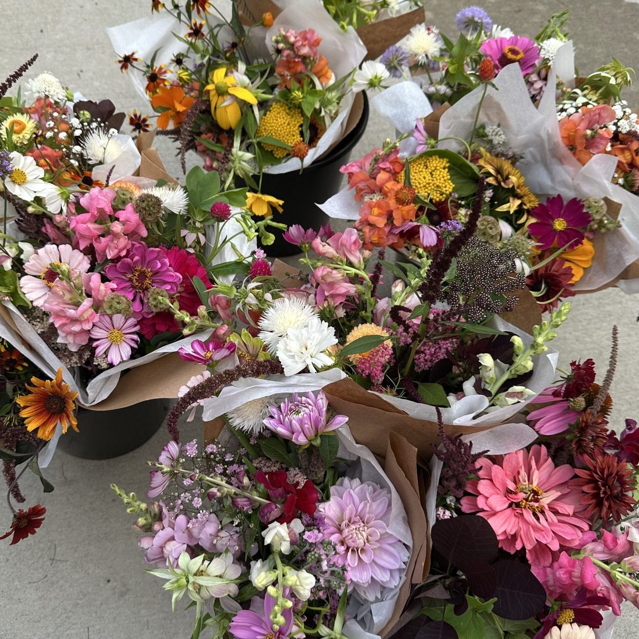 many bouquets in paper wrap