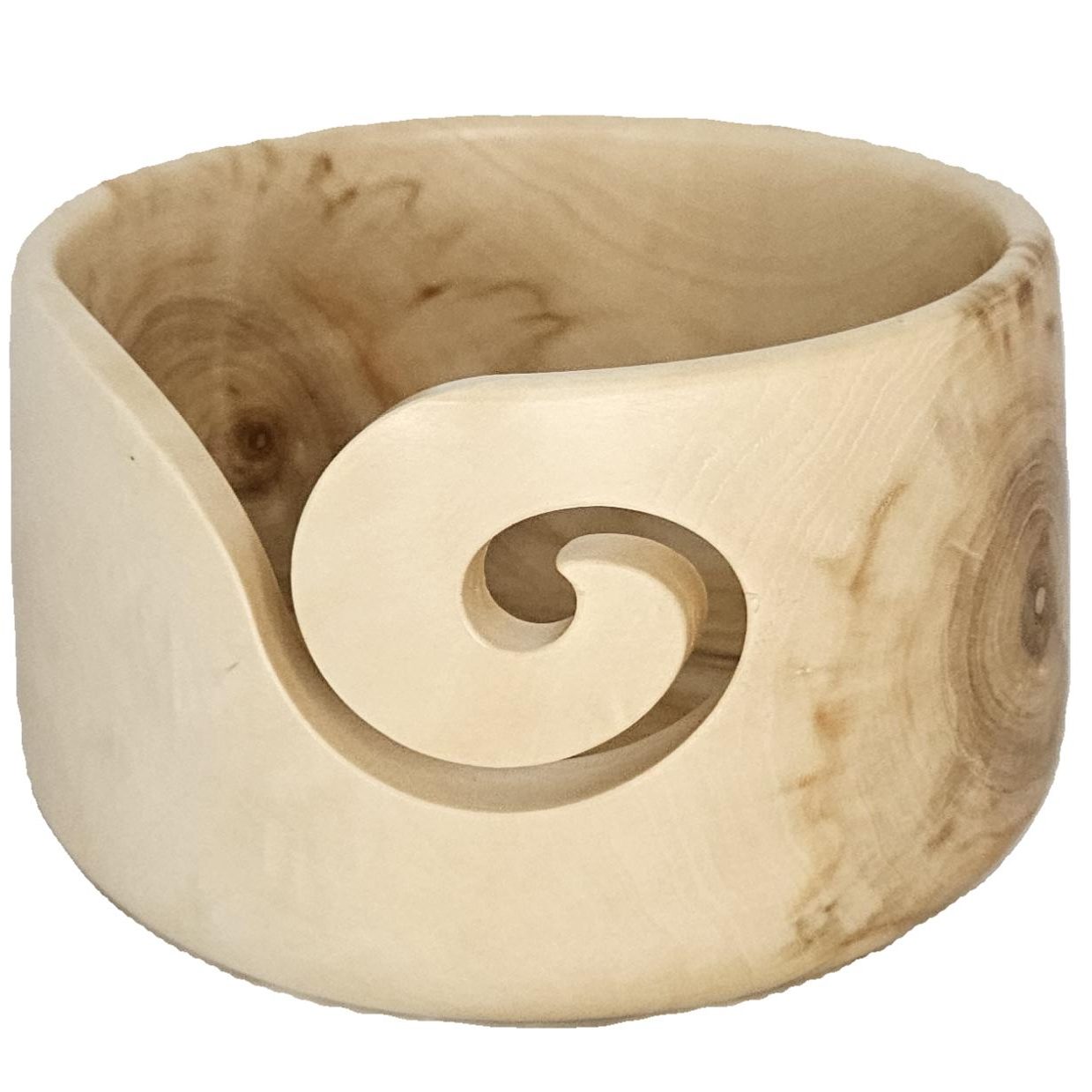 loght wooden bowl with a carved spiral