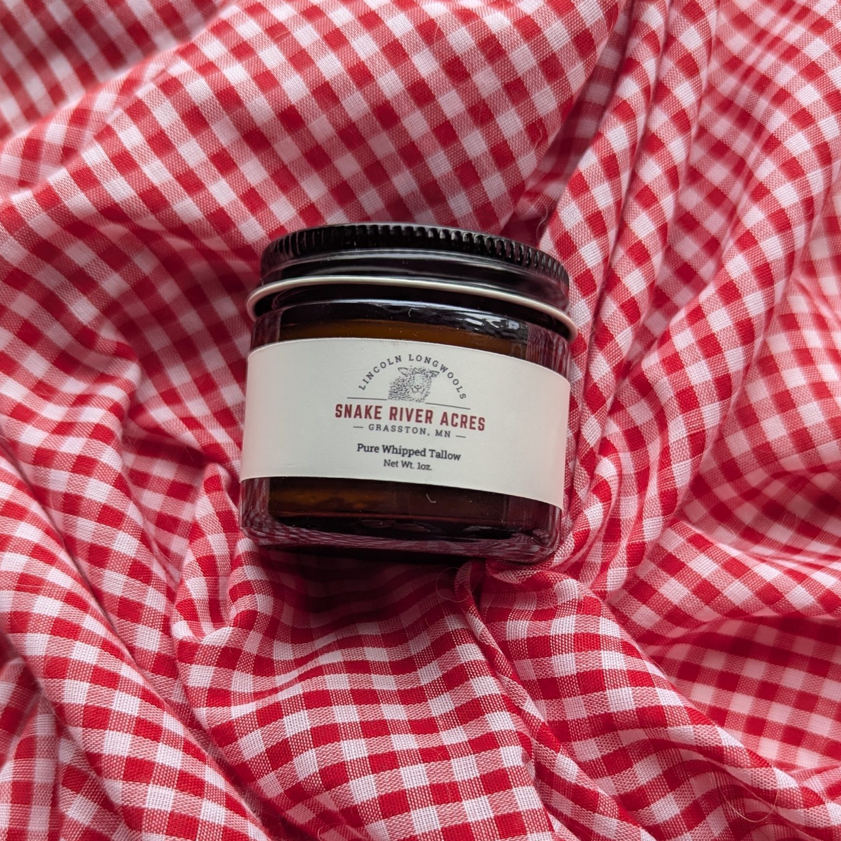 amber glass jar on a gingham background