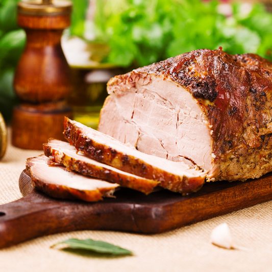 Roast pork with herbs and vegetables.